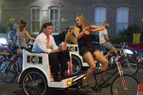 Pedicabs take people from campus to 6th street