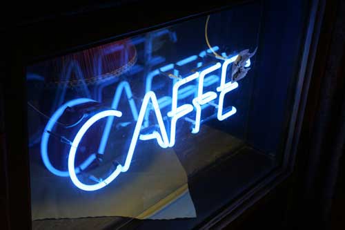 neon sign saying cafe